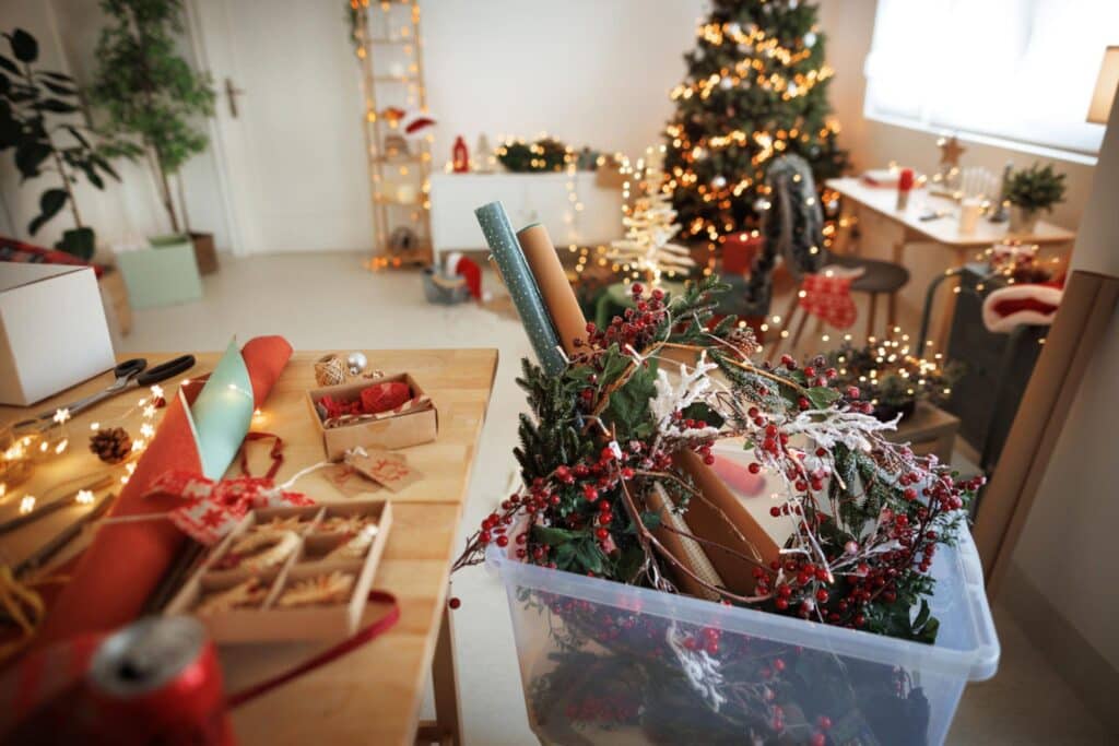 Messy living room with holiday decorations scattered about