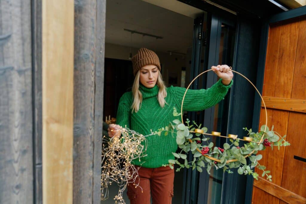 Woman at her mountain home quietly frustrated as she tried to untangle a string of lights.