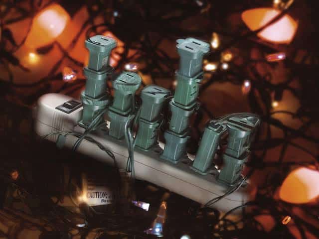 Power strip with multiple sets of lights plugged into one another