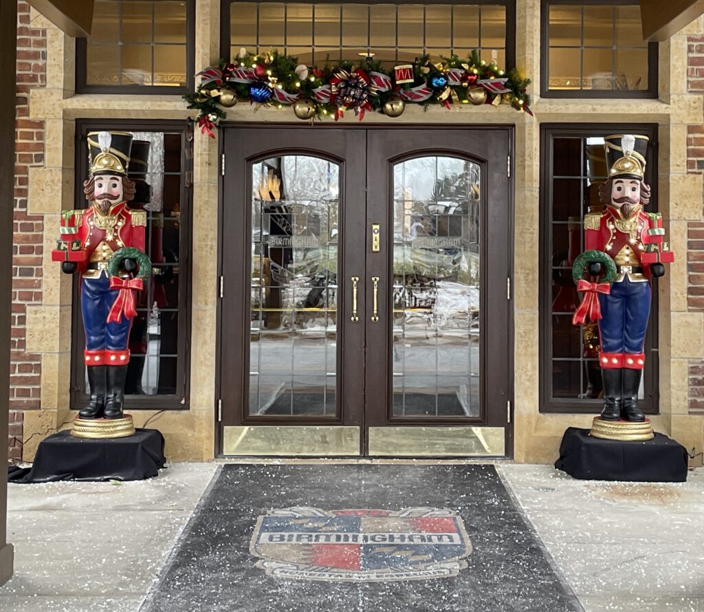 Nutcracker flanked french doors with garland that reflects the club's history & identify